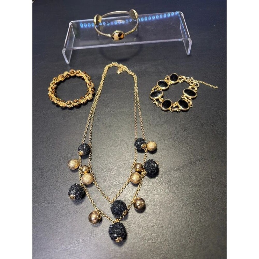 Black, gold, and cheetah jewelry
